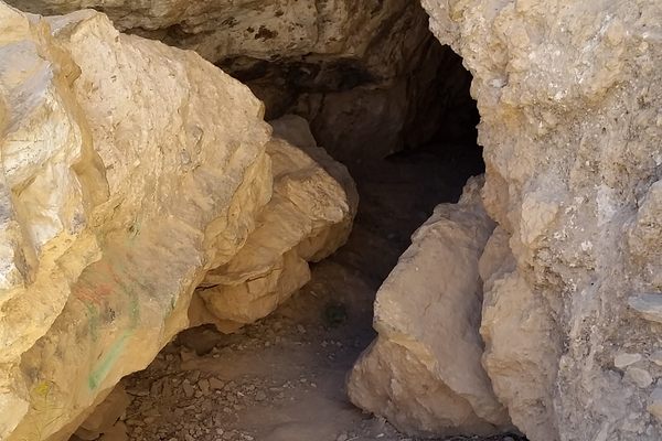 The cave entrance is unassuming.