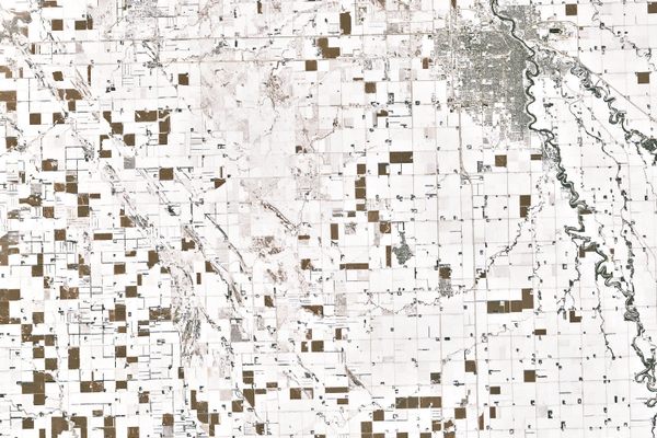 The patchwork shows expanses of snow, interspersed with fields of corn that are toughing out the winter weather.