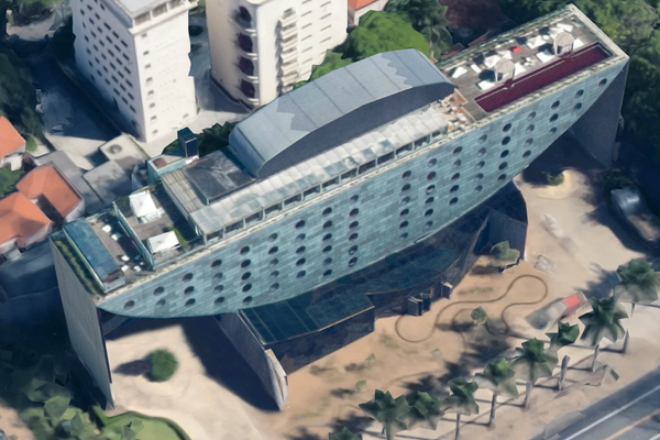 Aerial view of Hotel Unique with red pool on top