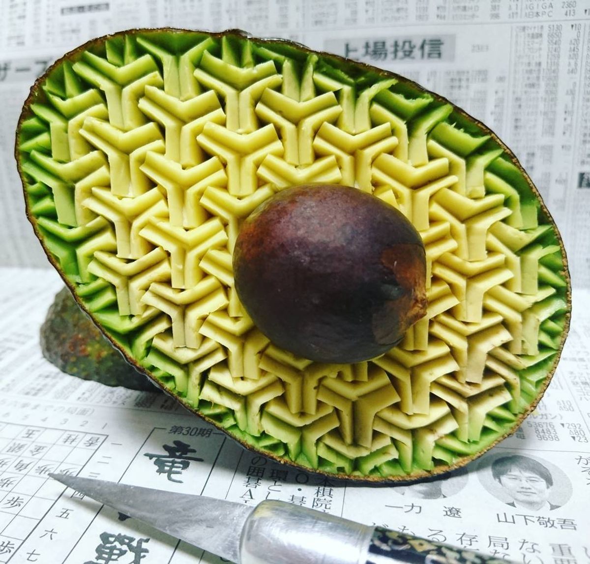 "Bishamon tortoise" motif, carved into an avocado.