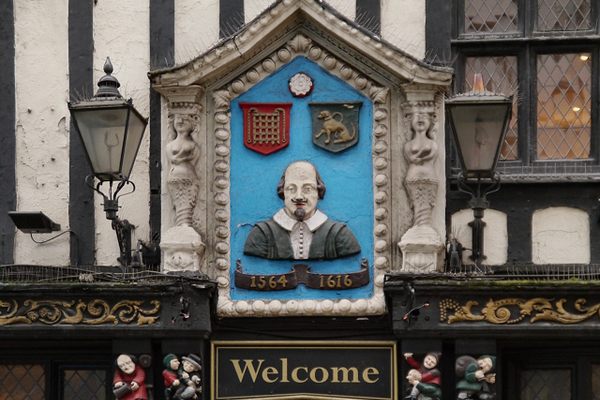 The Bard is represented on the sign. 