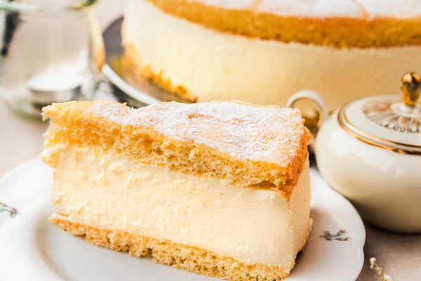 A slice of cake filled with vanilla bean-flecked custard.